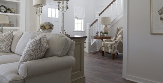 living room with staircase and front door